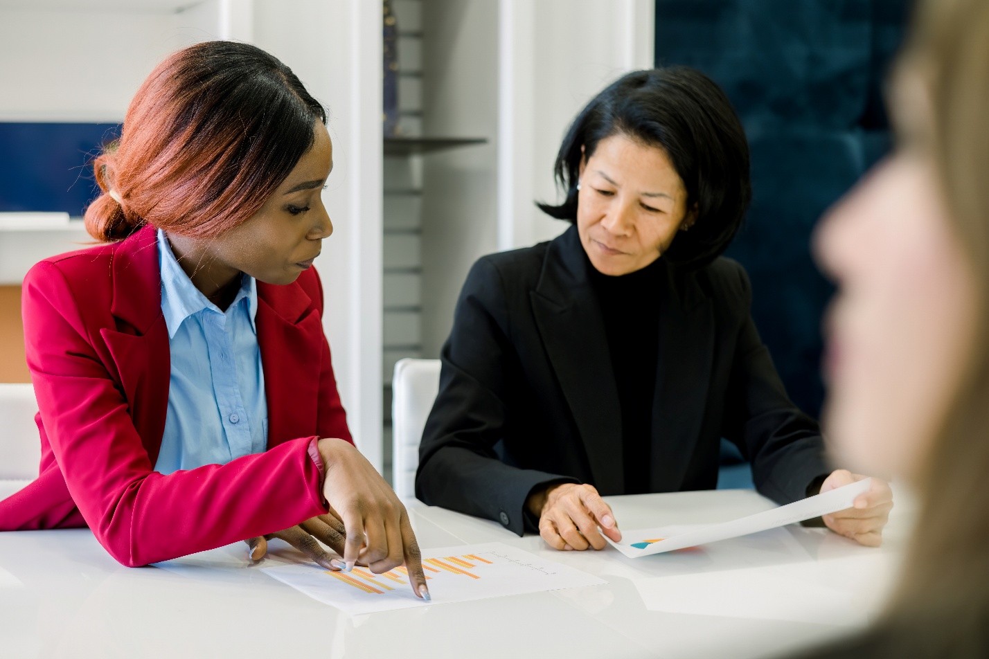 two women going over a document